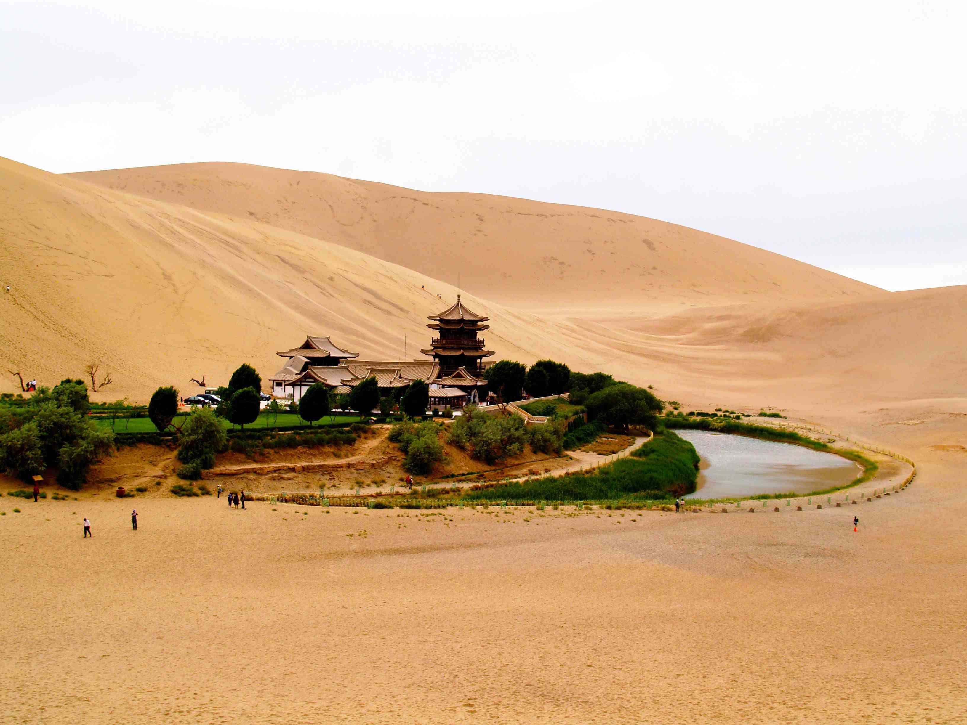 Crescent Lake oasis surrounded by sand dunes in the Gobi Desert, Dunhuang, China